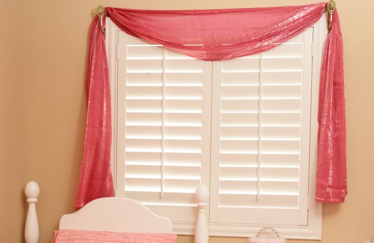Child's room with plantation shutters.